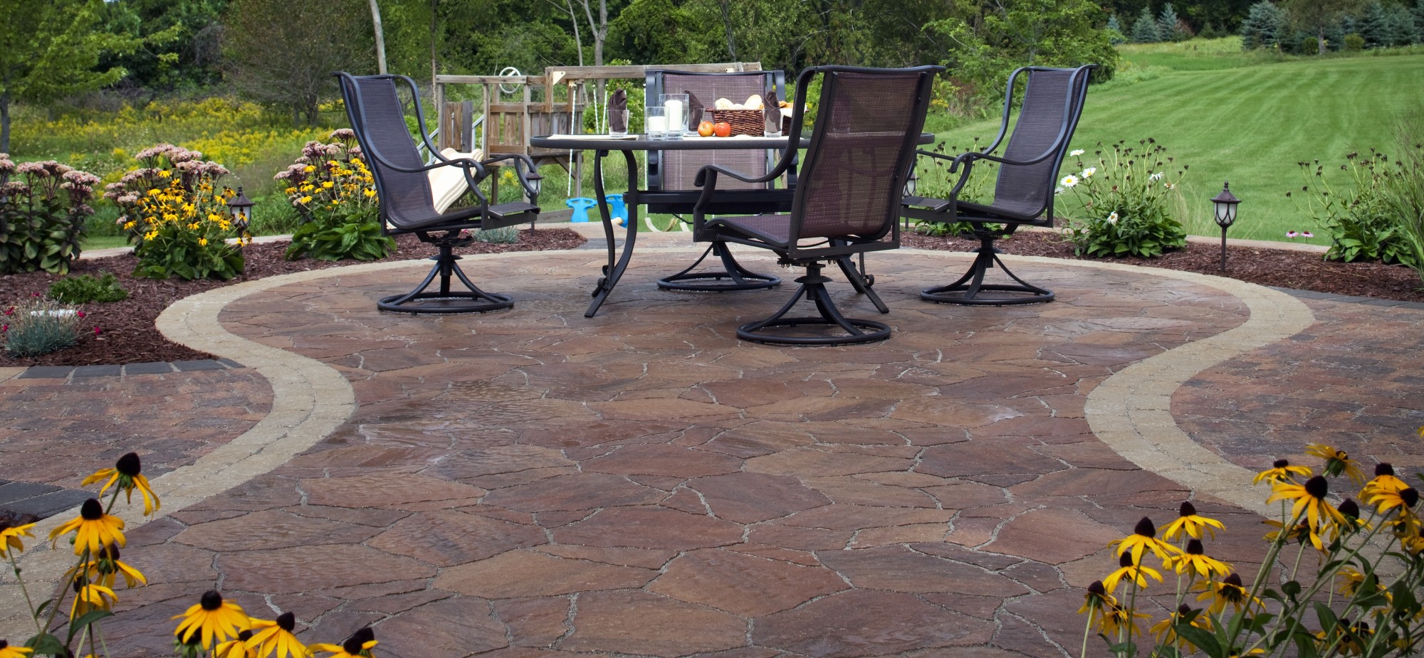 A paver patio with outdoor furniture